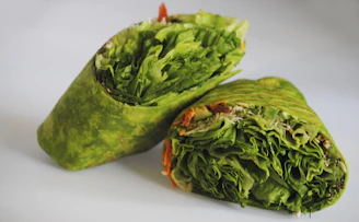 Close-up of a reusable beeswax food wrap covering fresh vegetables.