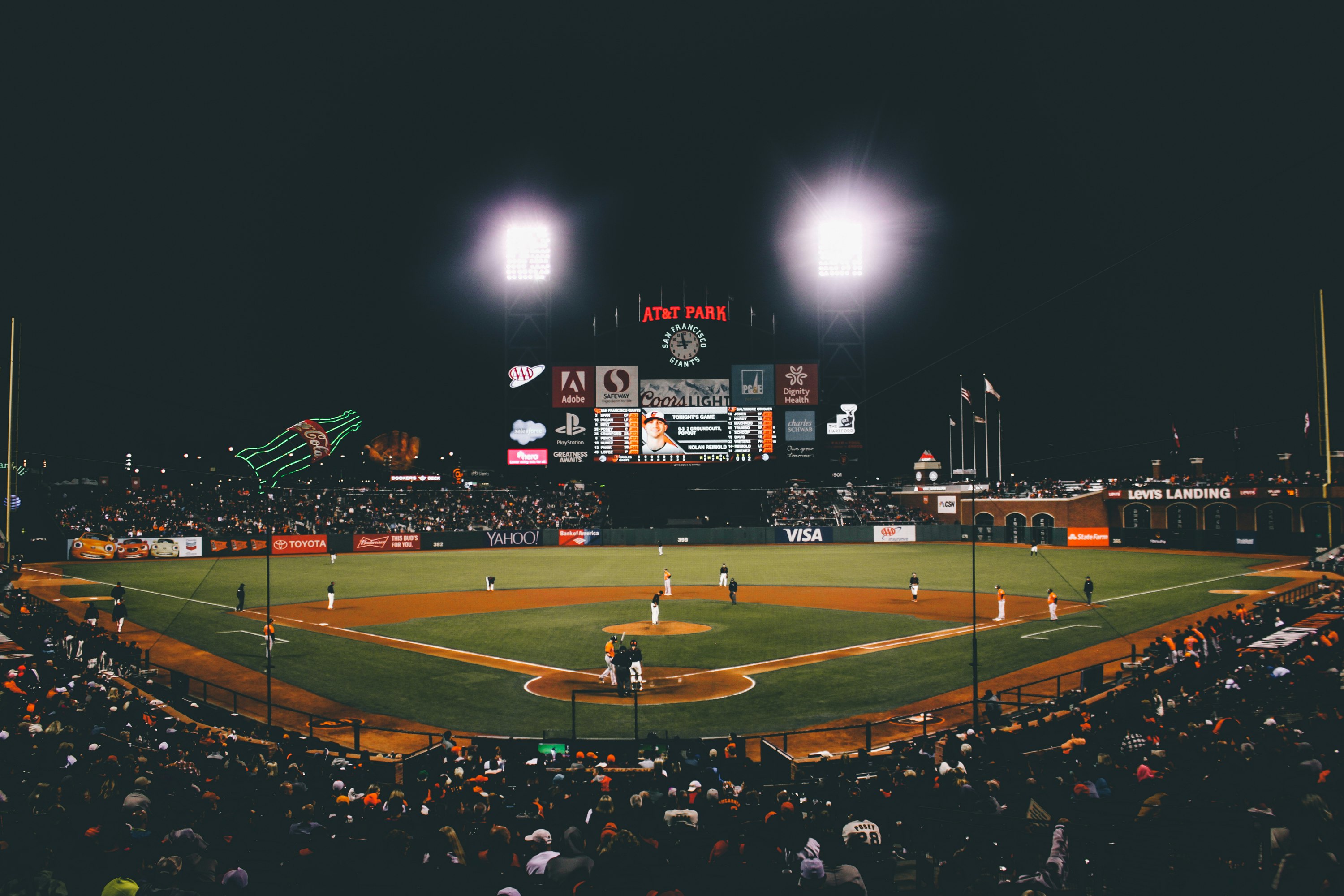 baseball player on baseball field during nighttime