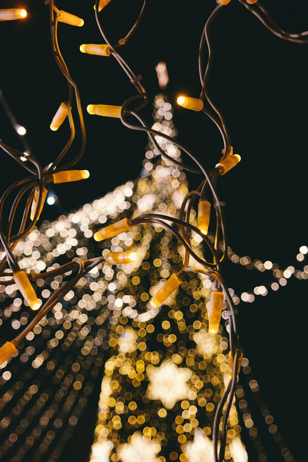 A blurred shot of a Christmas tree full of lights.