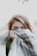 woman hiding her face with scarf