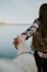 shallow focus photography of man and woman holding hands