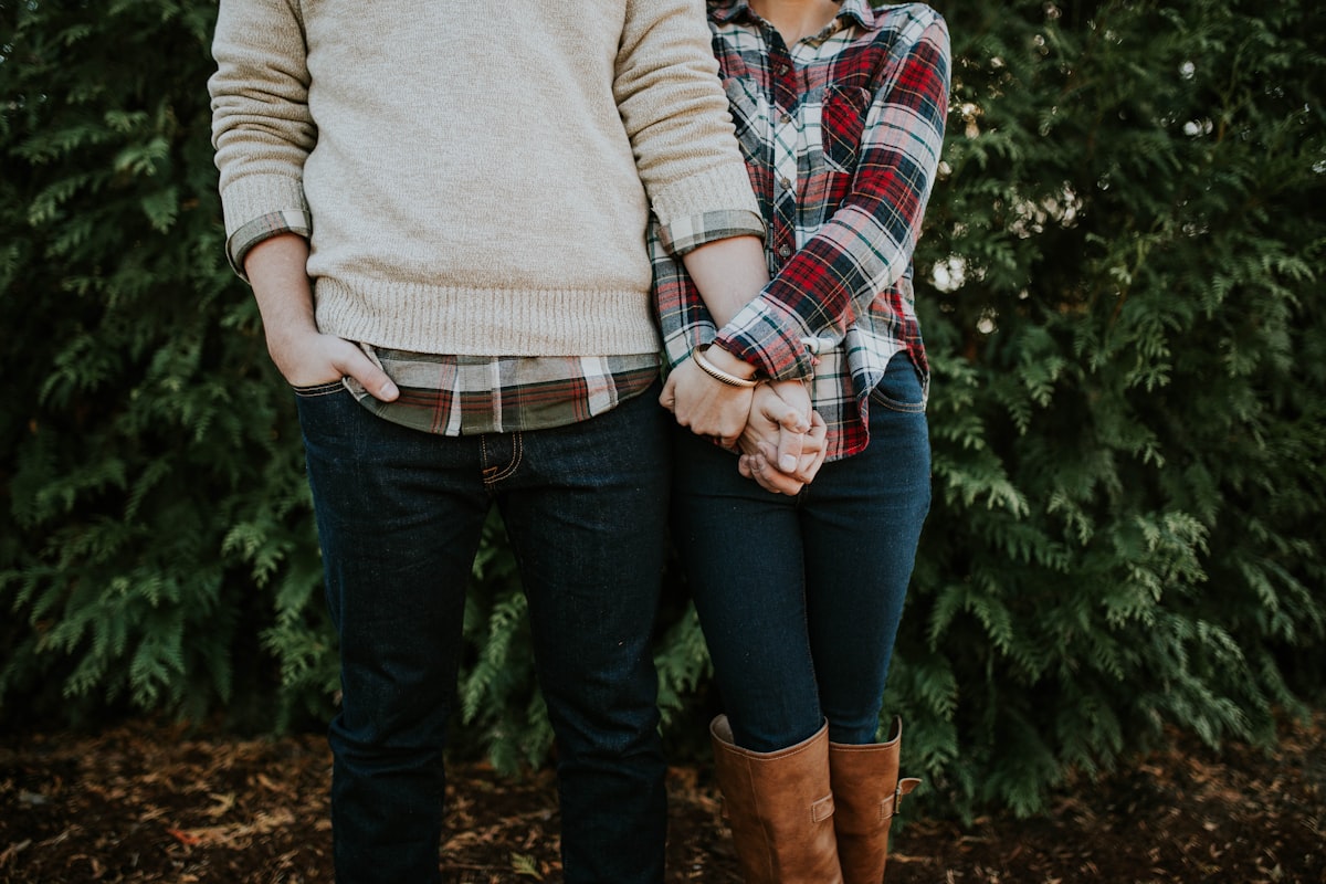 A young couple in love sitting close together