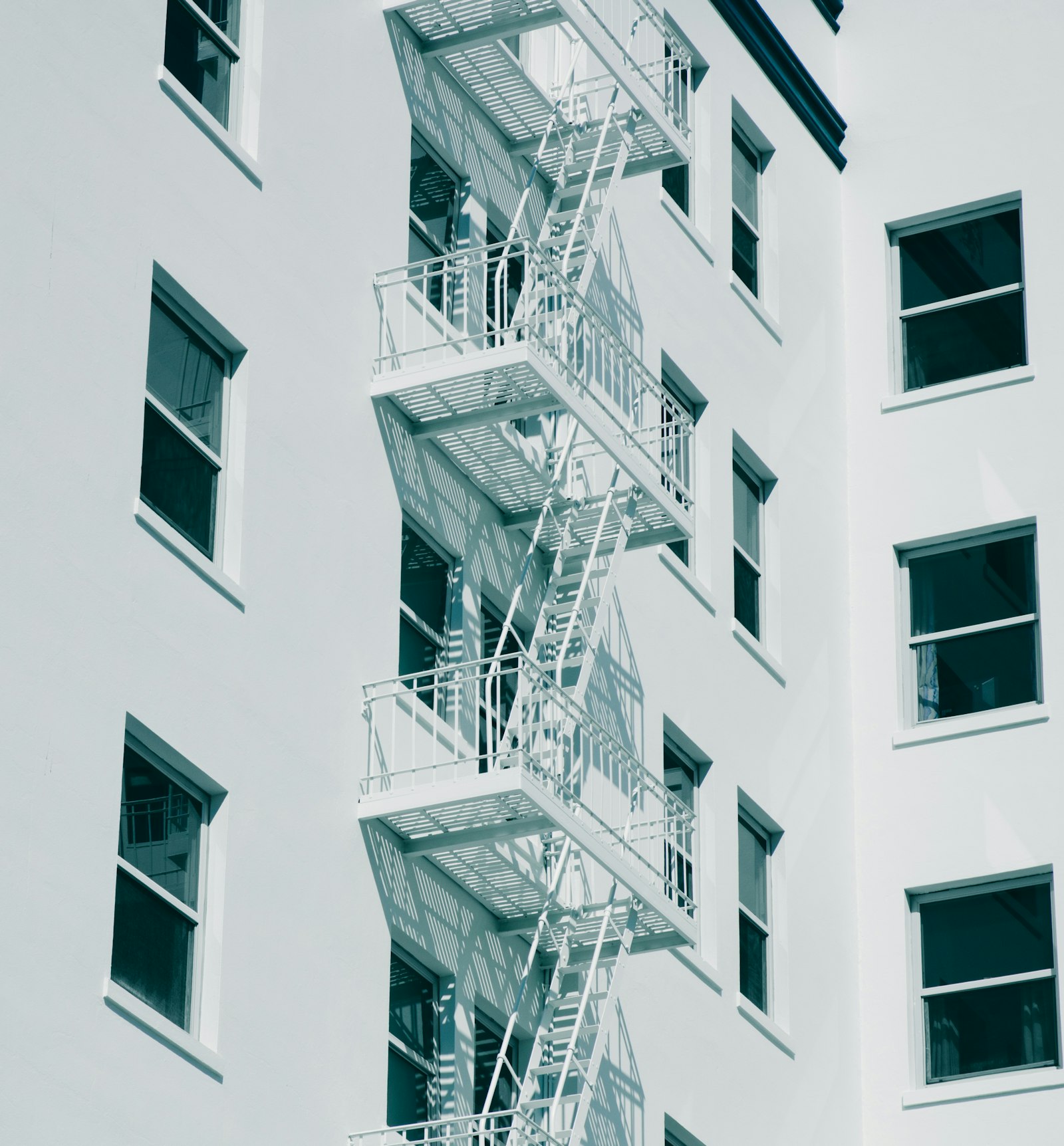 Canon EOS 760D (EOS Rebel T6s / EOS 8000D) + Sigma 24-70mm F2.8 EX DG Macro sample photo. Gray metal emergency staircase photography