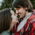 man and woman laughing at each other