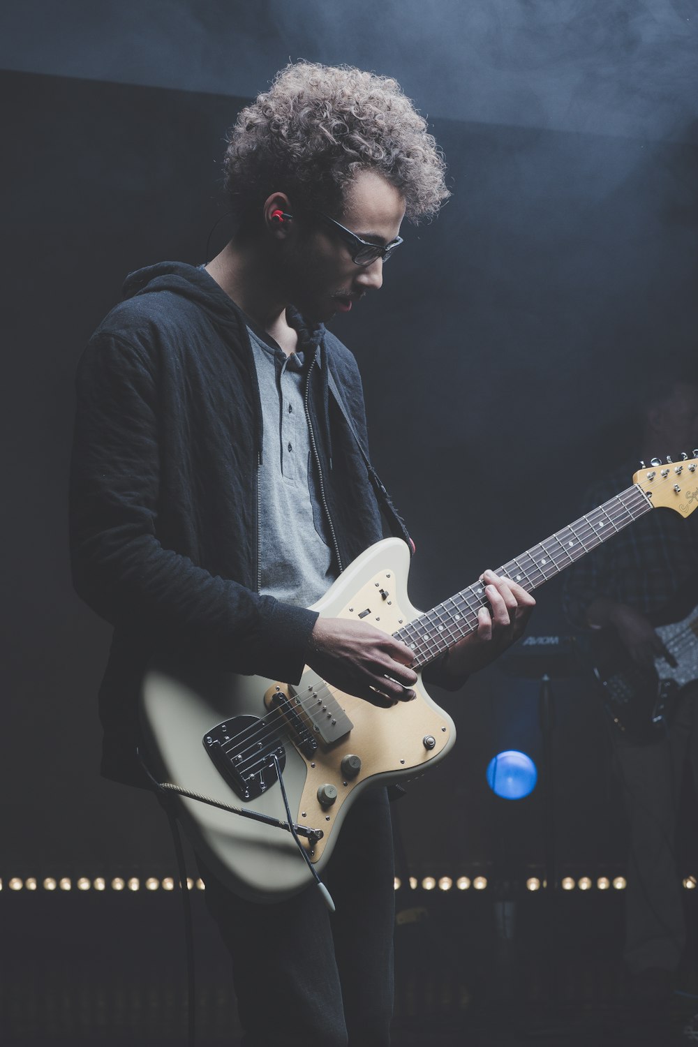 man playing with electric guitar