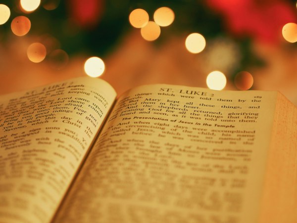 An open Bible with soft glowing light behind it
