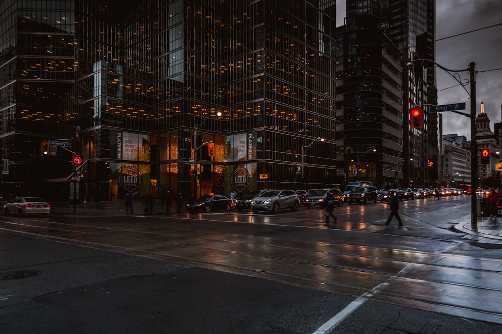 city road near buildings during midnight