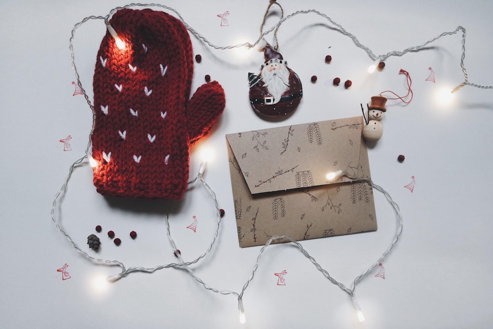 A winter mitt, card envelope and string tree lights.