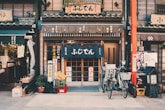 three bicycles parked in front of building