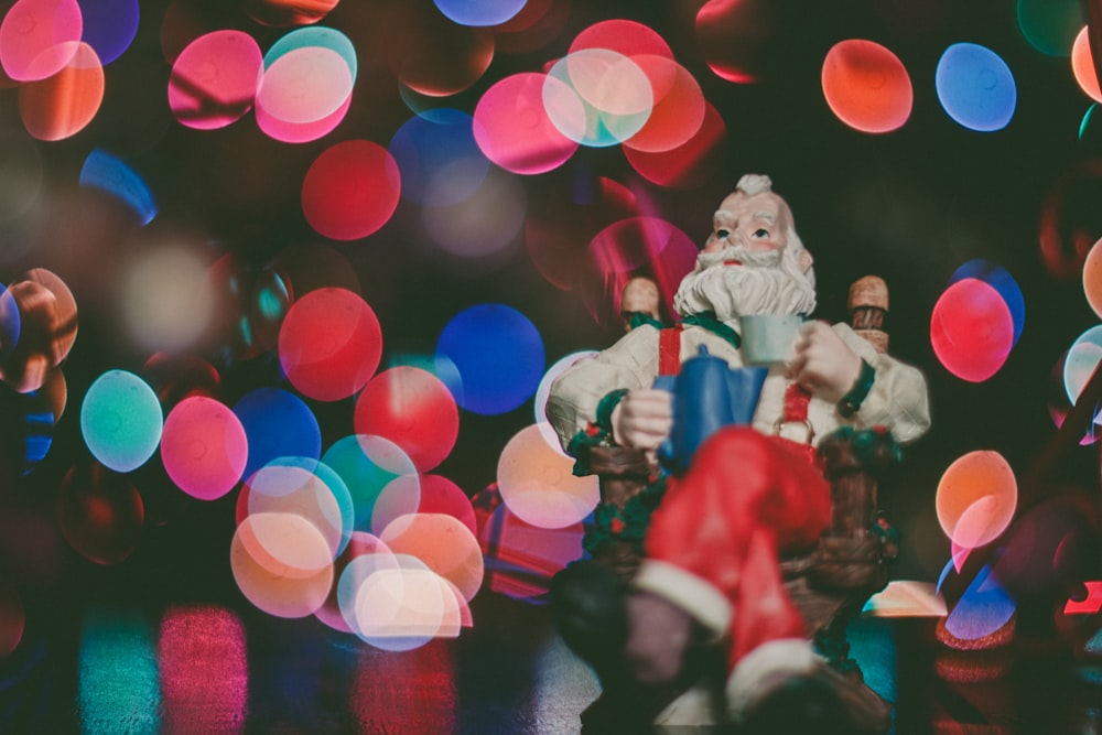 macro photography of Santa Claus figurine on top of surface