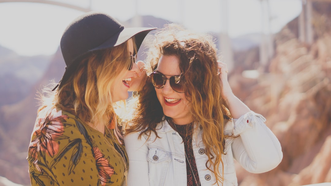 two woman sisters-in-law smiling for each other