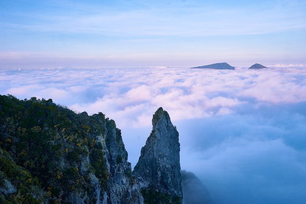 mountain covered with clouds during daytime