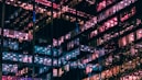 architectural photography of building with people in it during nighttime