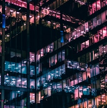 architectural photography of building with people in it during nighttime