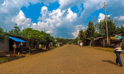 A rural village delivery point with parcels and crates.