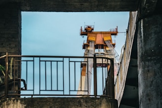 Orange transformer factory building exterior under clear sky