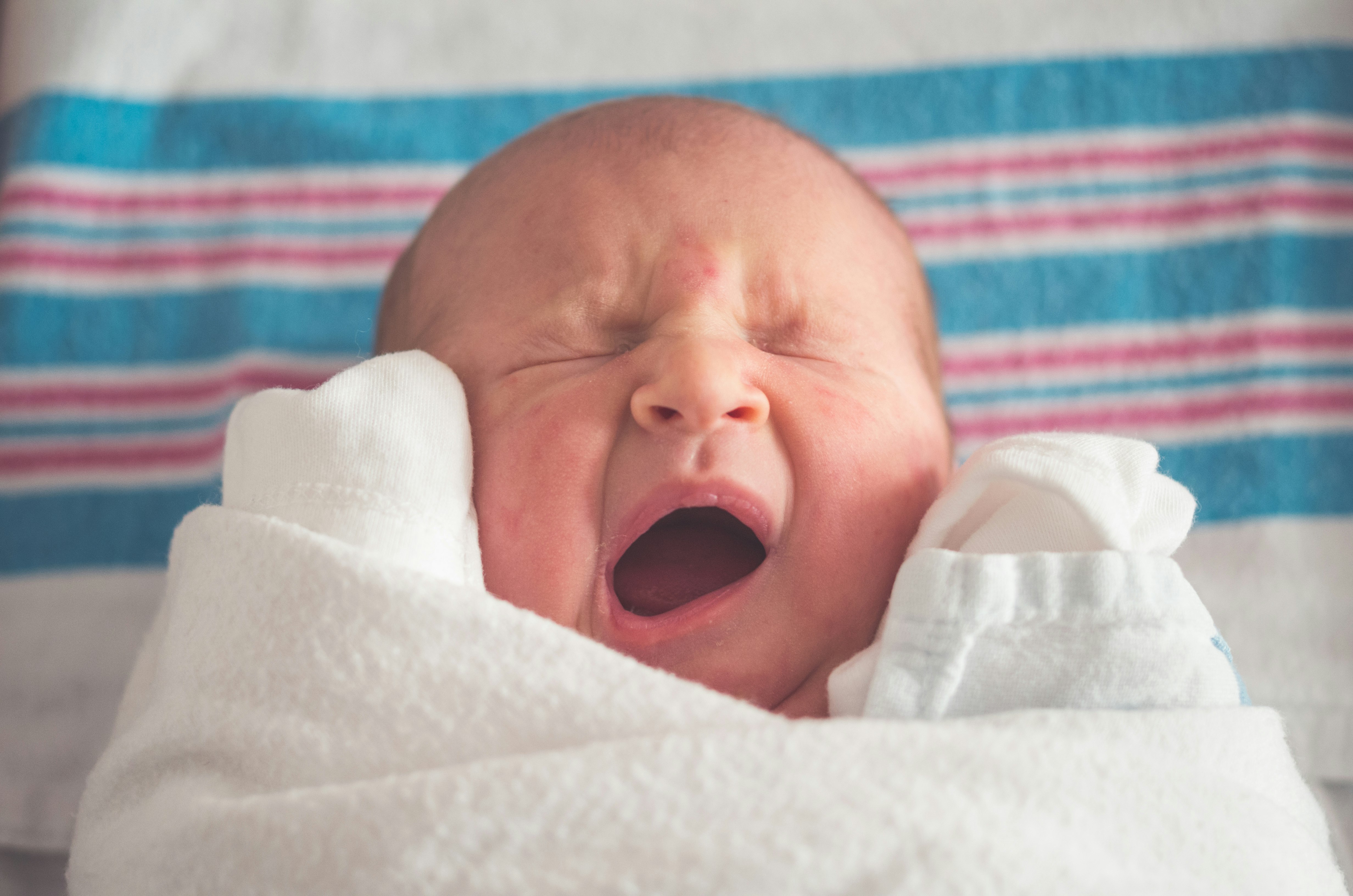 My newest daughter, we have 4, was just about a day old when I caught this cute image of her yawning. Being born is apparently hard work!