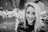 grayscale photo of woman with string lights