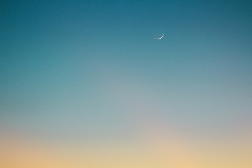 crescent moon on blue sky