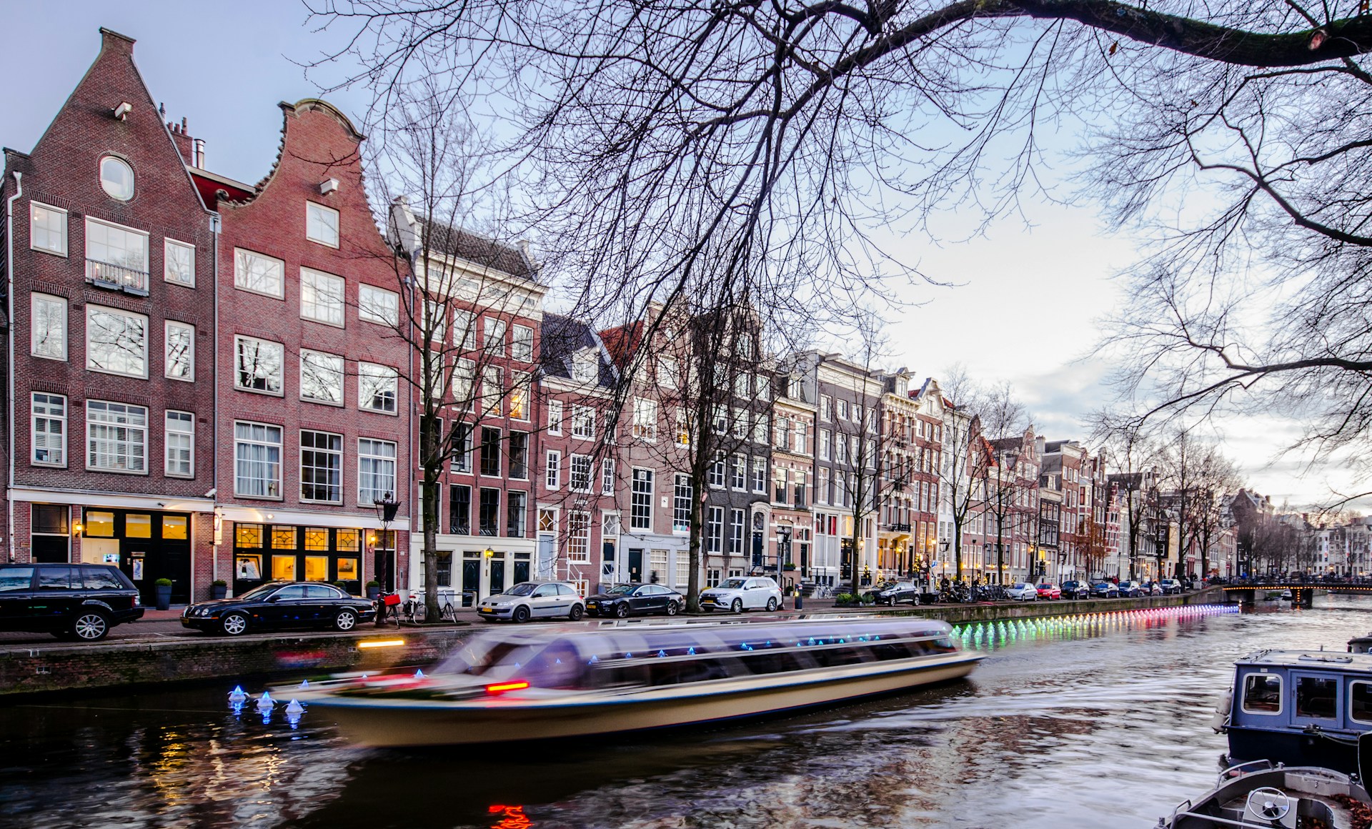 woman wearing yellow long-sleeved dress under white clouds and blue sky during daytime