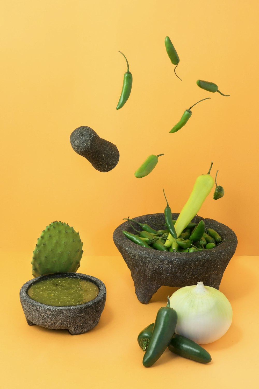 Various vegetables on an orangish yellow surface.