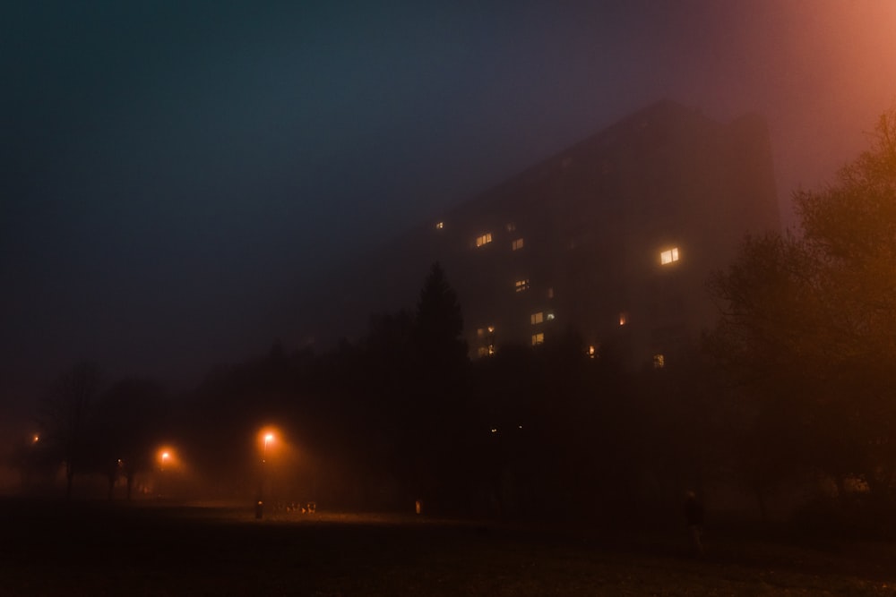 A large building on a foggy night.