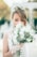 bride smelling the flowers
