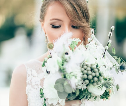 bride smelling the flowers