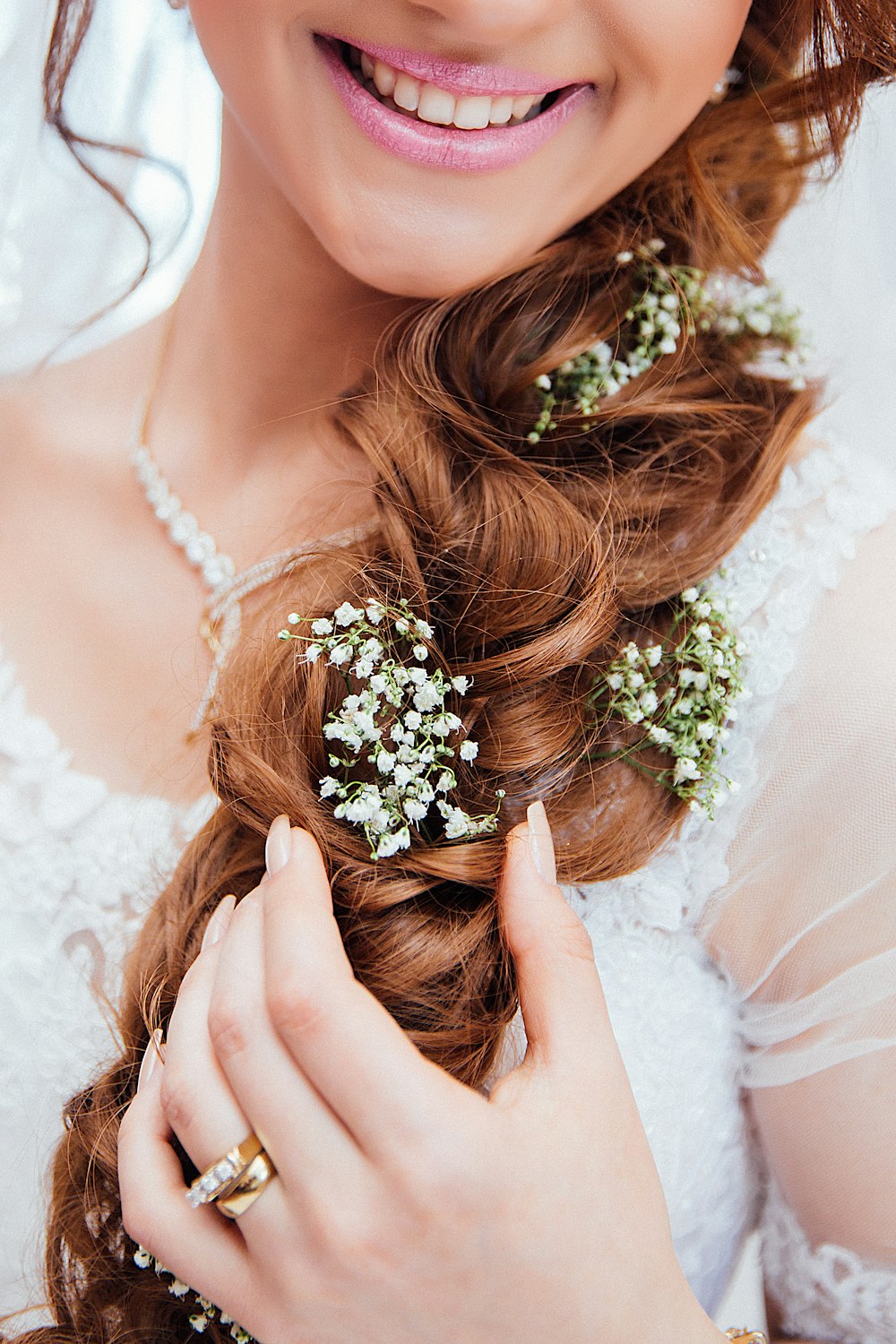 woman holding her hair with flower