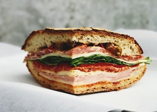 ham sandwich on white surface
