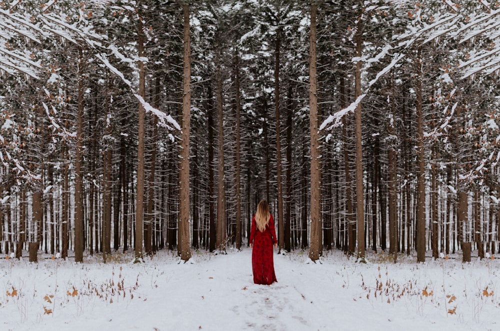 woman standing in front of forest