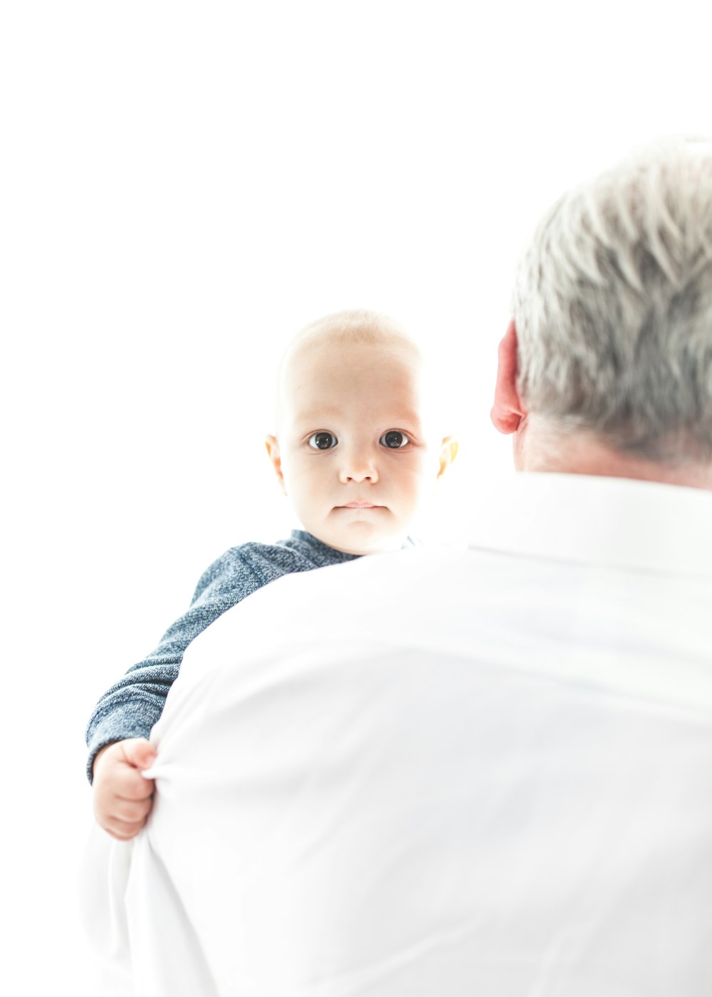 man carrying a baby