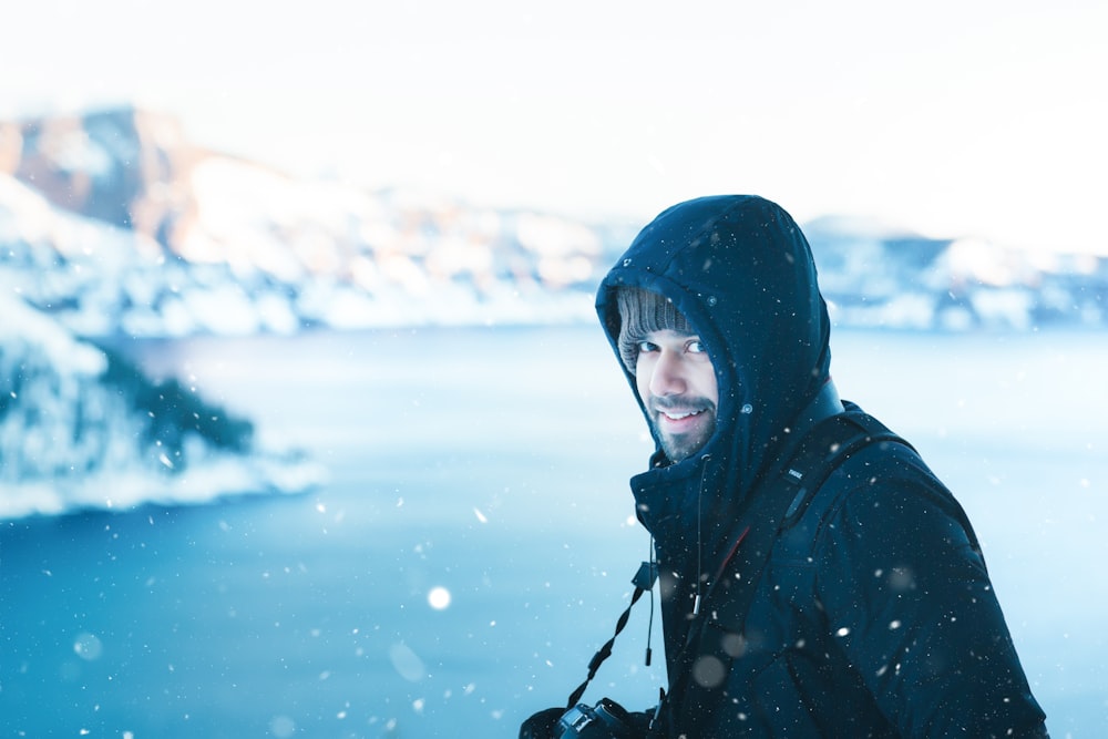 person standing near body of water