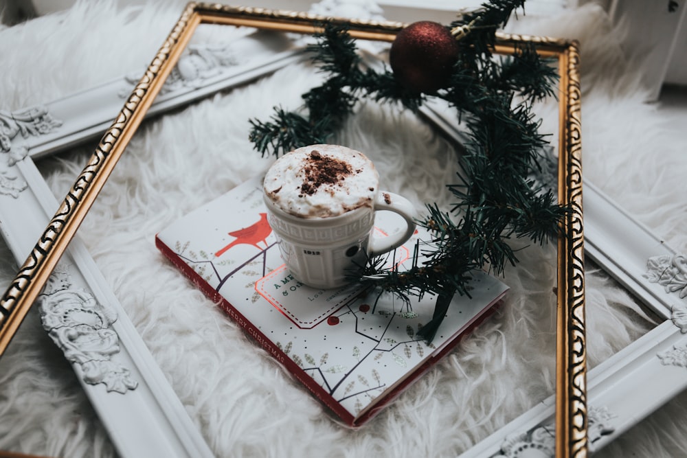 white ceramic mug filled with whit mousse