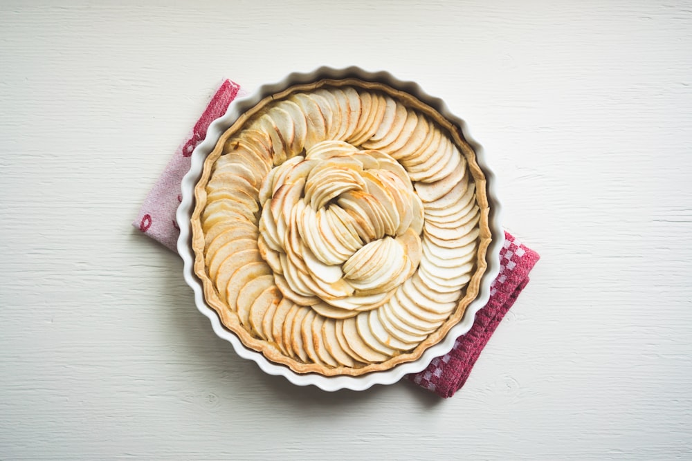 Homemade apple pie topped with fresh slices of fruit