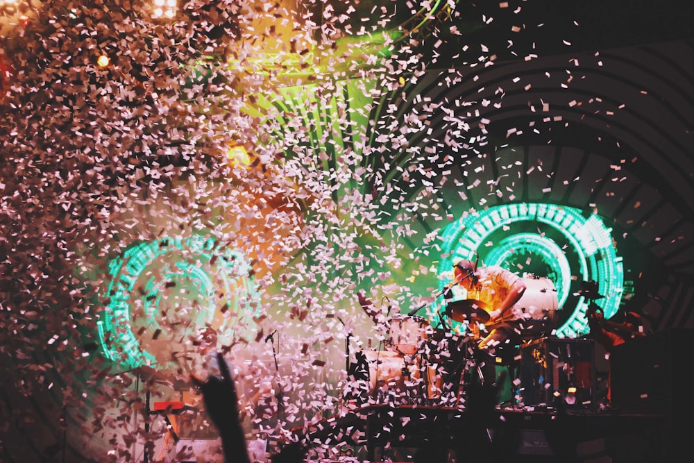 pink confetti dropping on lighted stage