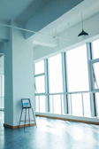 High-resolution photo of a sleek modern interior with minimalist furniture and natural light.