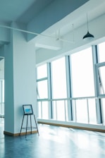 Minimalist atelier workspace bathed in soft natural light, featuring elegant emerald green accents.