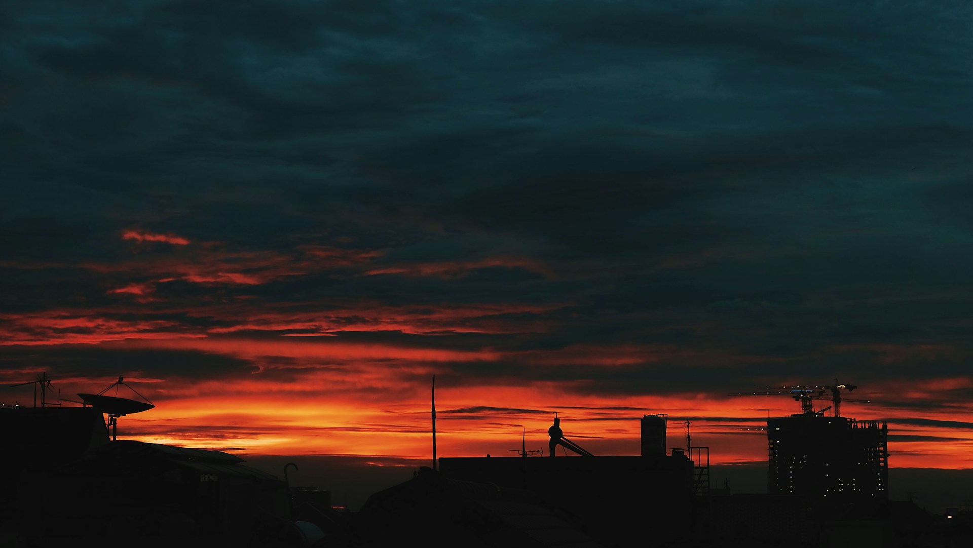A striking still from a recent independent film, featuring a dramatic sunset over a city skyline.