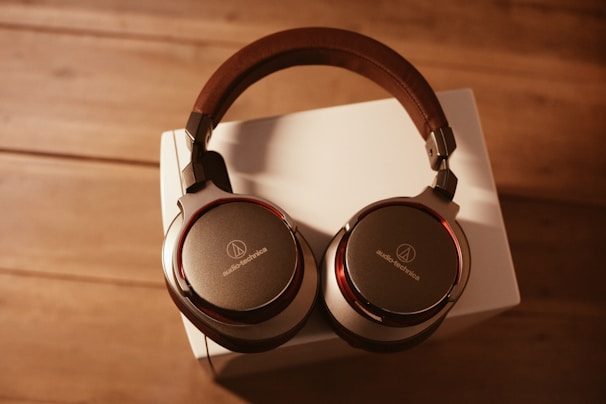 Elegant over-ear headphones displayed with soft natural lighting highlighting their design
