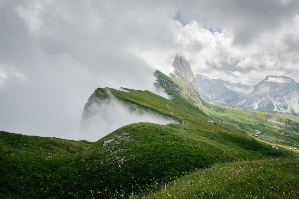 green mountain with fog