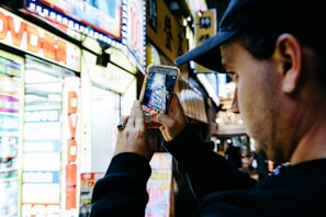 A candid shot of a team member capturing photos of a local festival in Okinawa