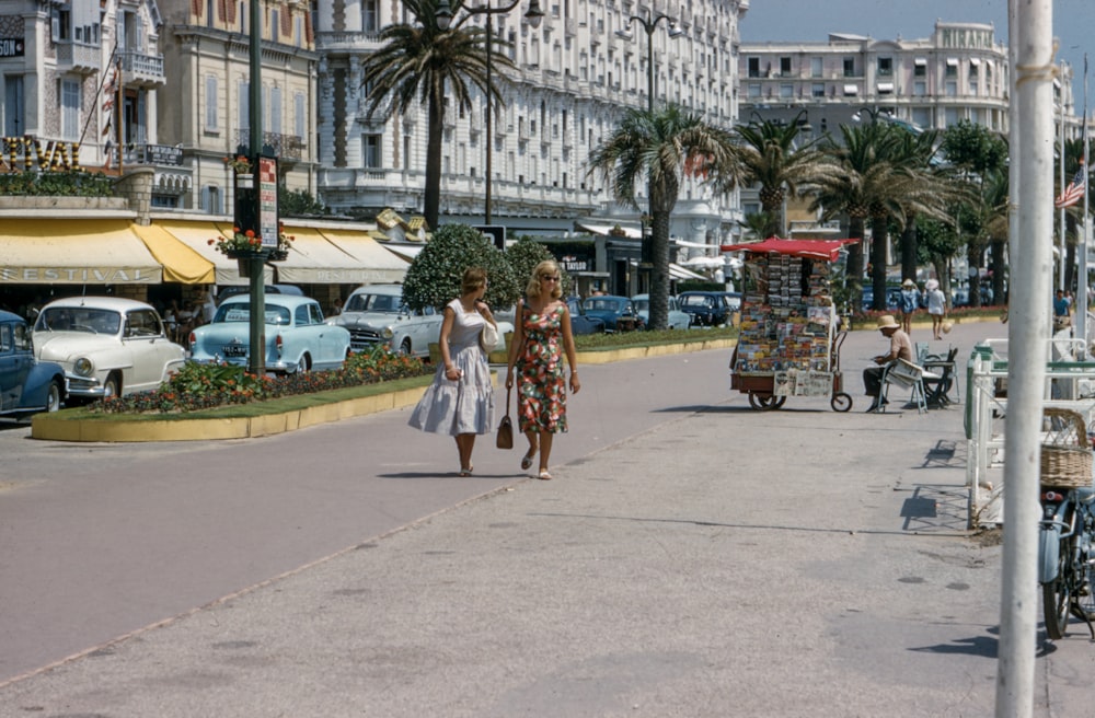 two women walking on street