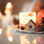 white ceramic house miniature on top of table