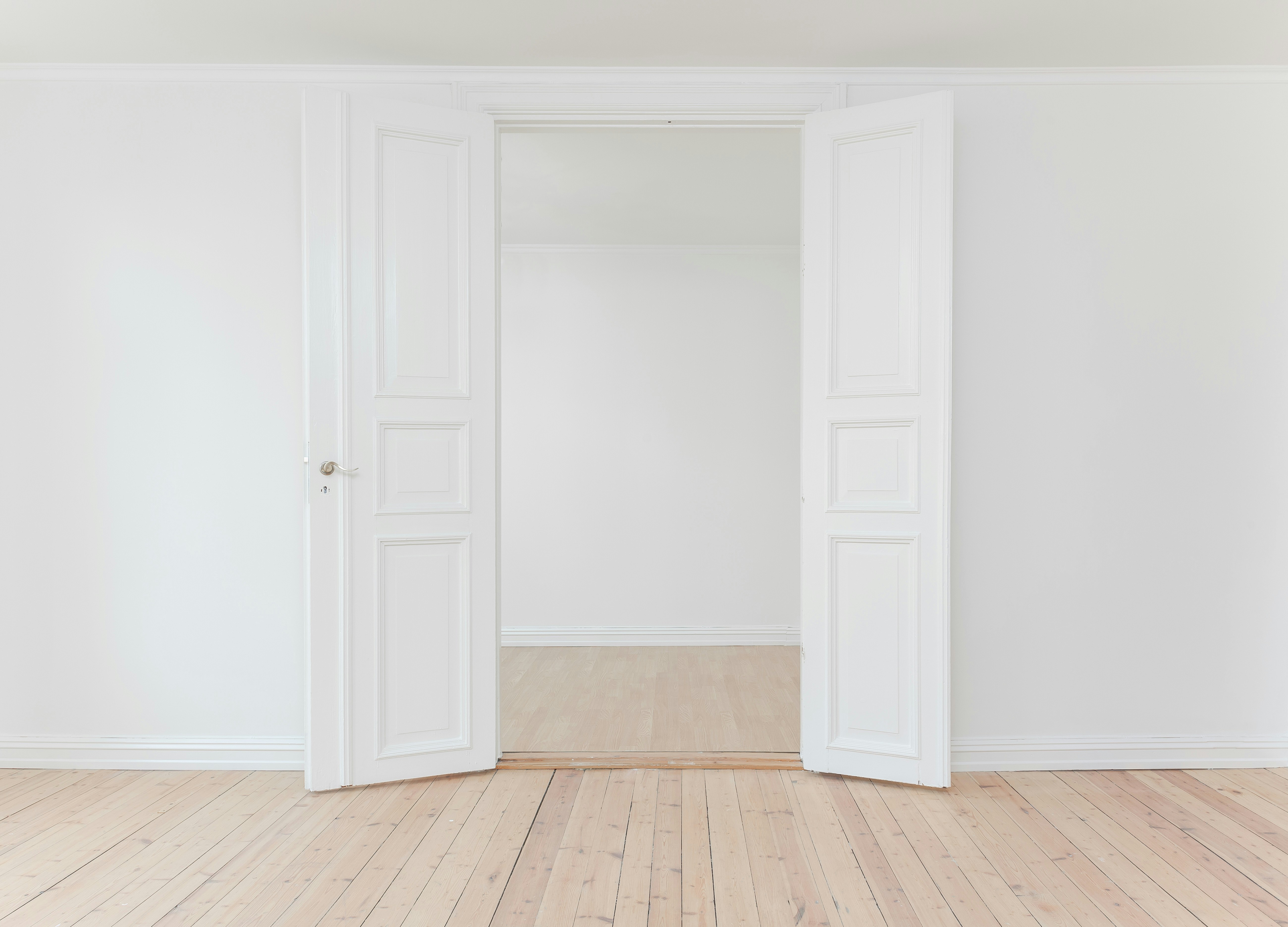Door in a white room