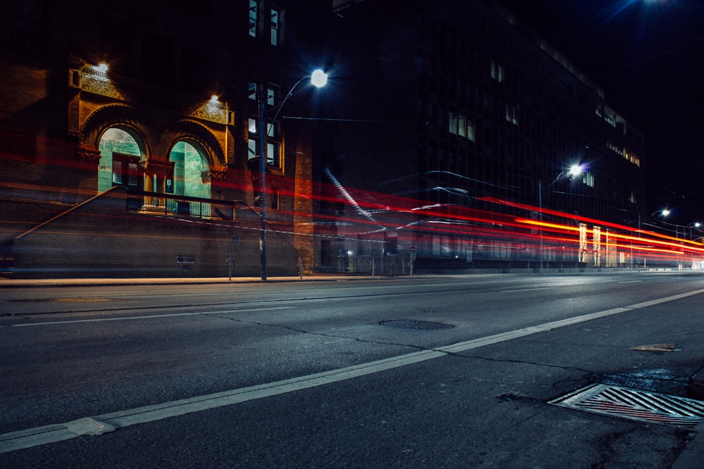 time-lapse photo of buildings beside road