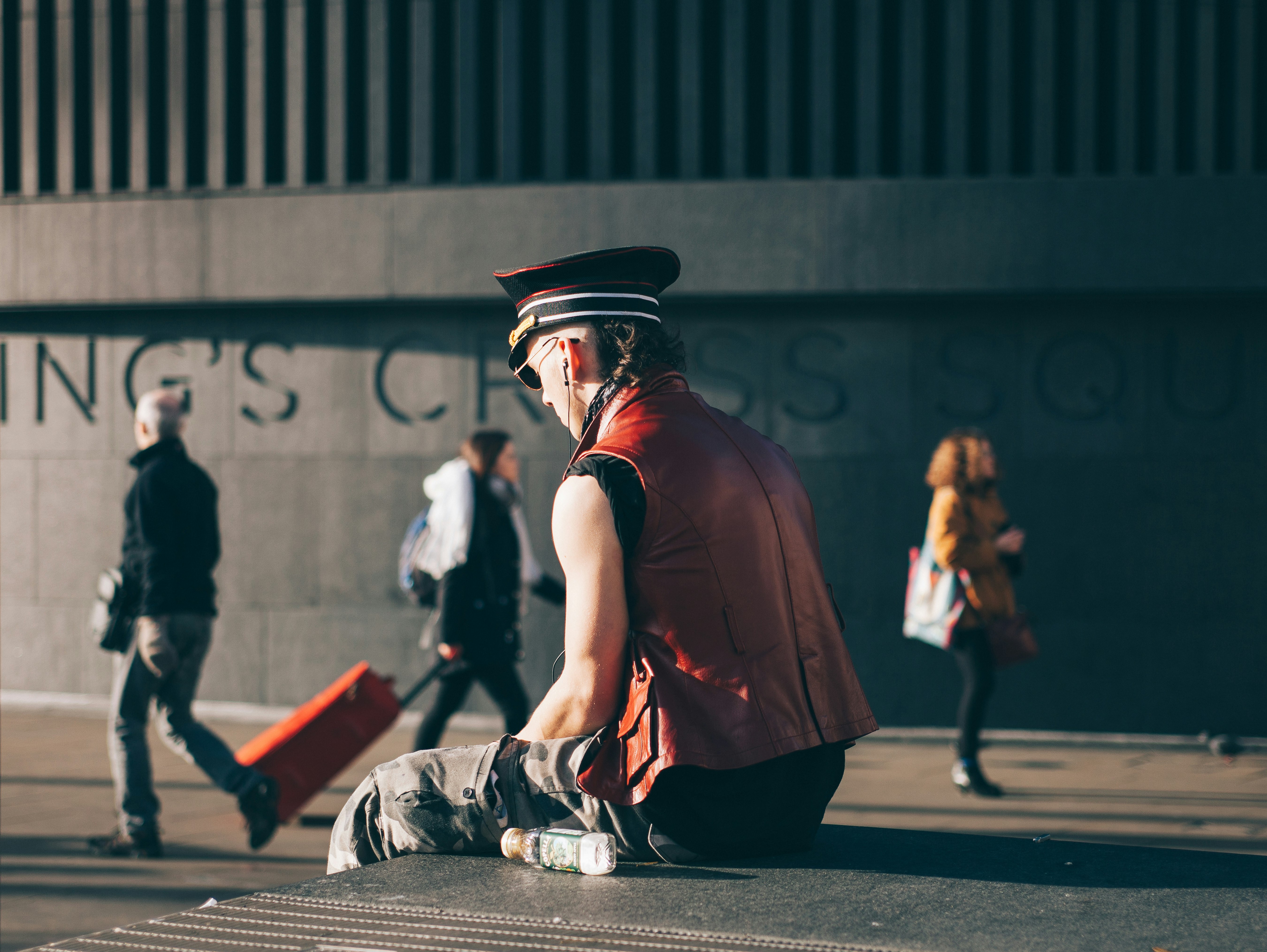 man sitting on pavement