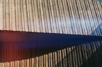 A wide shot of a freshly finished concrete slab shining under the afternoon sun.