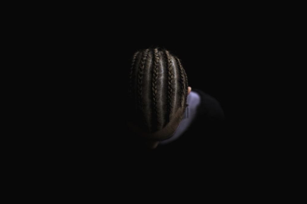 person showing braided hair