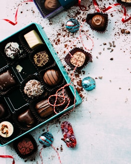 Seasonal chocolate collection beautifully wrapped with festive ribbons.